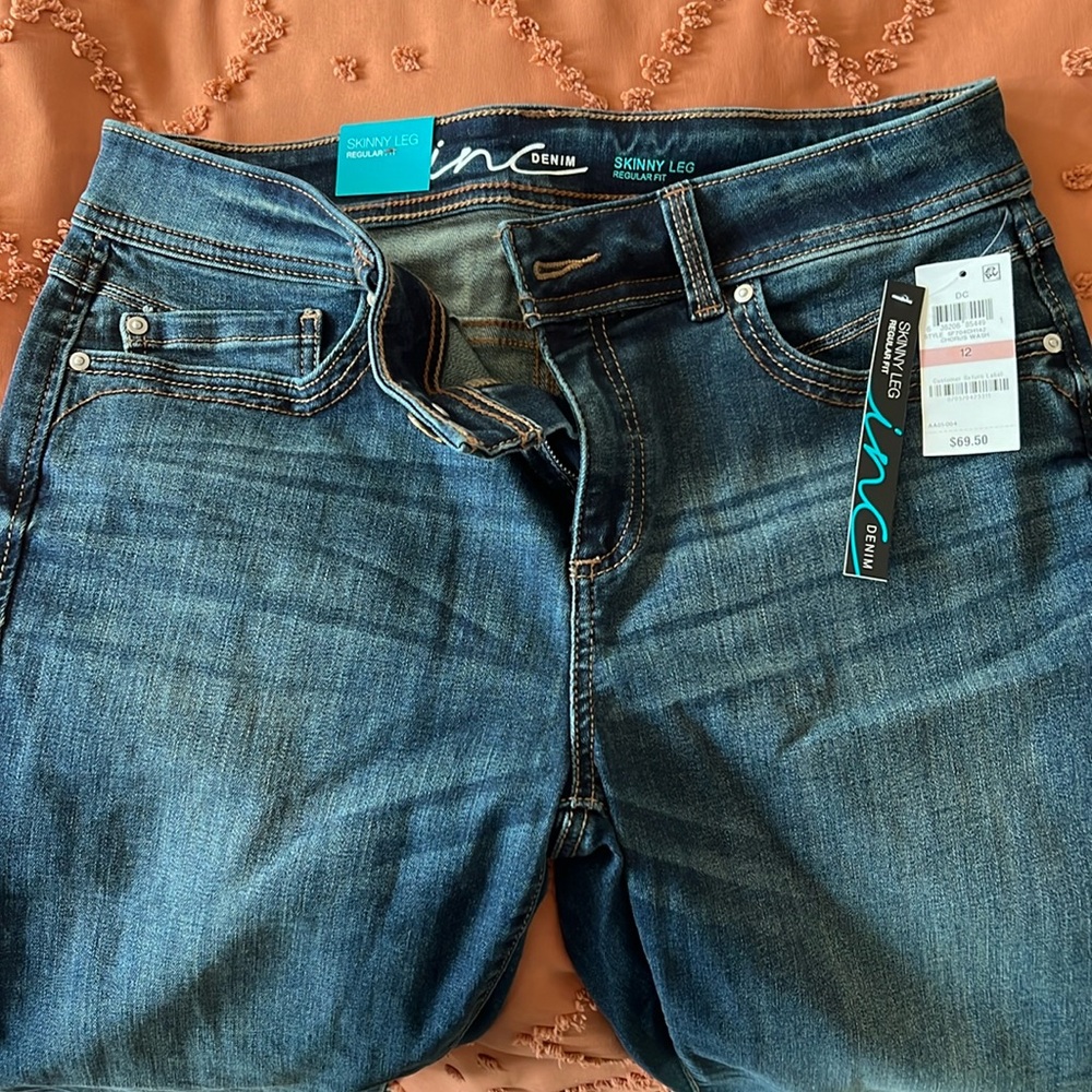 INC skinny leg, regular fit jeans.